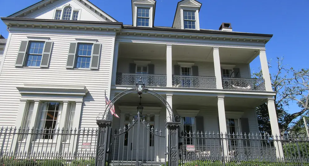 A raised New Orleans home in the Garden District, the kind of property treated for roof rats